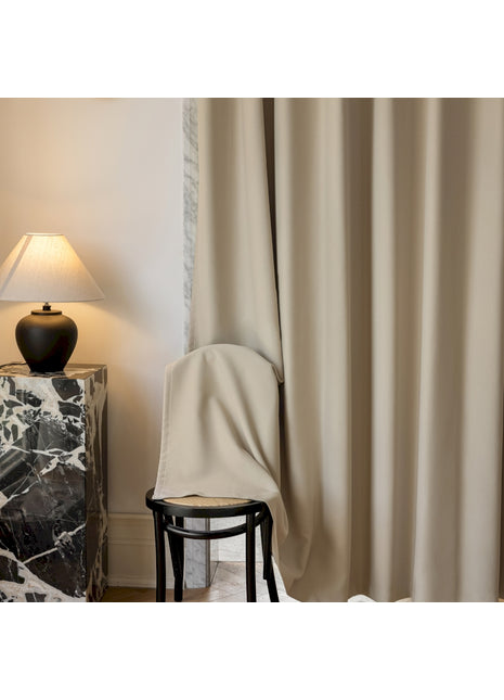 a chair and a lamp in a room