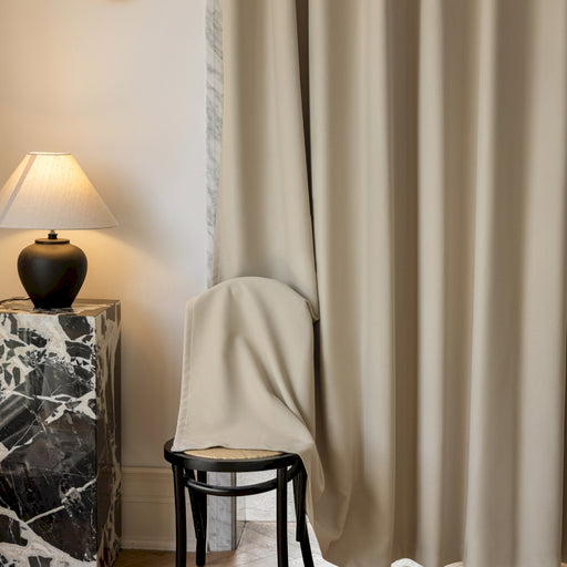 a chair and a lamp in a room