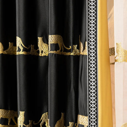 a curtain with a black and gold design