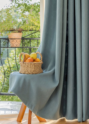 a basket of fruit sitting on top of a wooden stool