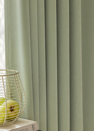 a basket of apples sitting on top of a book