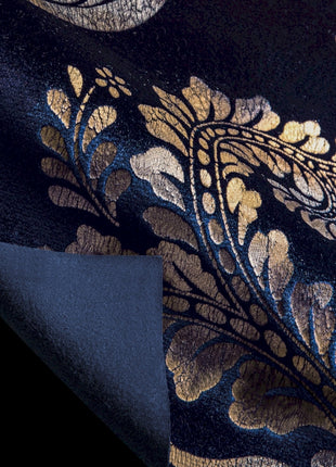 a close up of a blue and gold tie