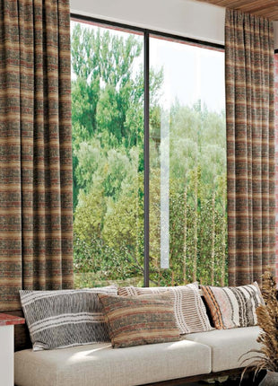 a living room filled with furniture and a large window