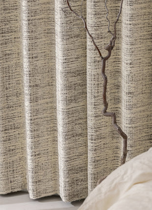 a tree branch sticking out of the side of a window