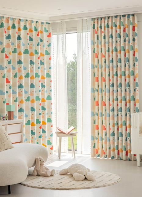 a baby's room with colorful curtains and a white crib