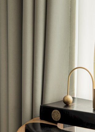a table with a candle and a book on it
