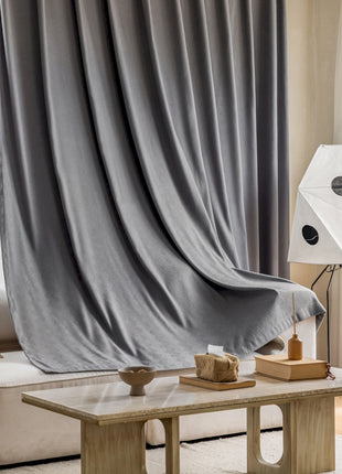 a living room with a couch and a table