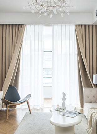 a living room filled with furniture and a chandelier