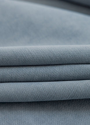 a close up shot of a plain blue fabric