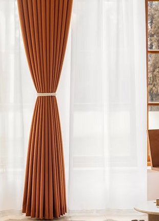 a living room with a chair and a window