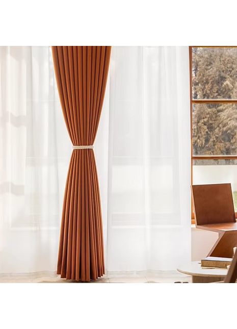a living room with a chair and a window