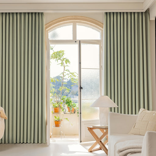 a living room filled with furniture and a large window