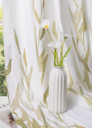 a white vase filled with flowers on top of a window sill