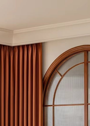 a living room with a couch and a window