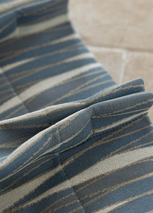 a close up of a blue and white striped fabric