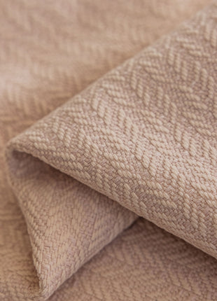 a close up of a blanket with a textured pattern