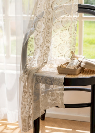 a chair sitting in front of a window next to a window