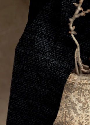 a close up of a person's hand holding a purse