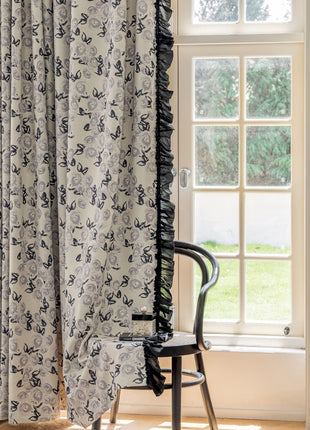 a chair sitting in front of a window