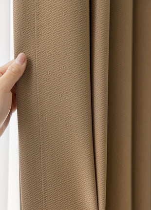 a person is holding a curtain in front of a window