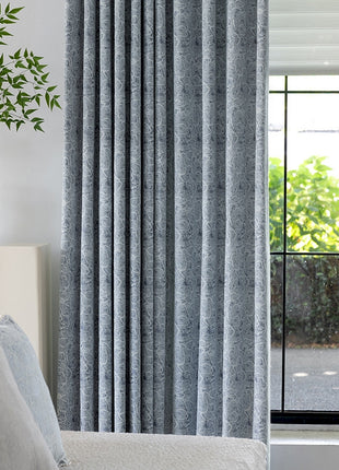 a living room with a couch and a window