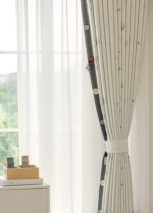 a room with a white curtain and a plant in the corner