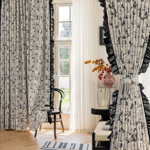 a living room with a chair and a window