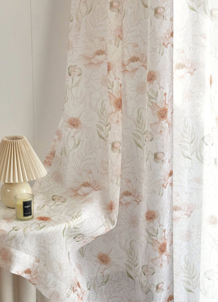 a white table with a lamp and a white curtain