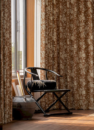 a chair sitting in a room next to a window