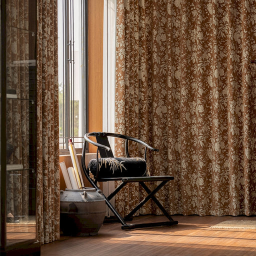 a chair sitting in a room next to a window