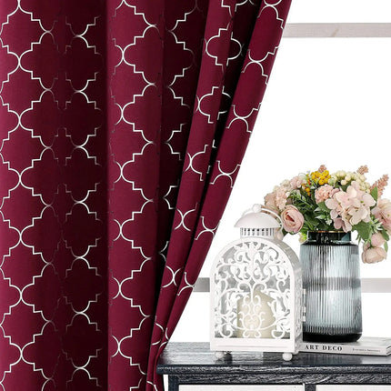 a vase of flowers sitting on a table next to a window