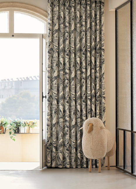 a sheep is standing in front of a door