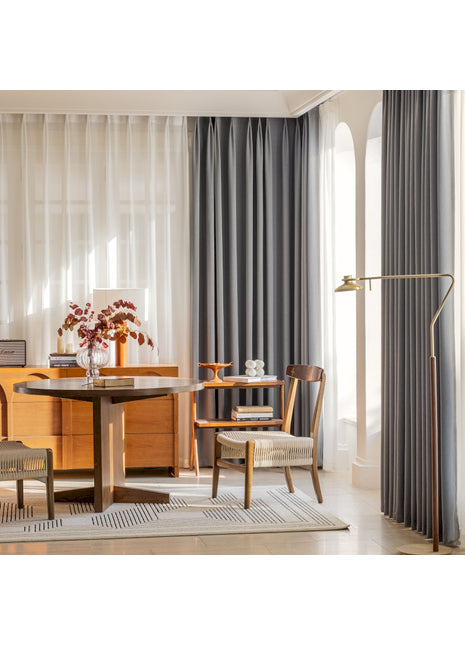 a living room with a table and chairs