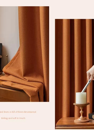 a person holding a candle in front of a window