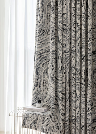 a giraffe standing next to a window in a room