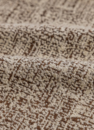 a close up of a brown and white blanket