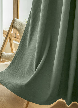 a chair and a curtain in a room