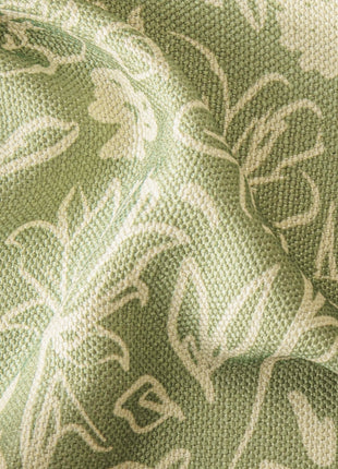 a close up of a green and white fabric