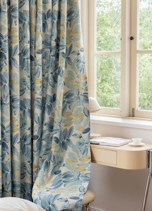 a bedroom with a bed, desk and window