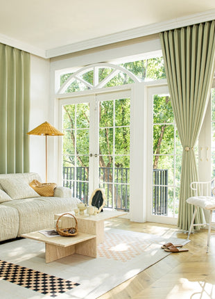 a living room filled with furniture and a large window