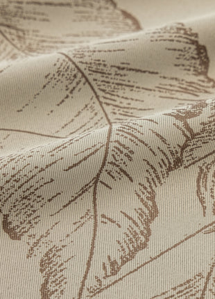 a close up of a fabric with leaves on it