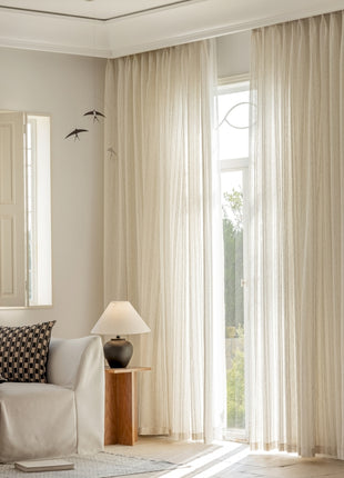 a living room filled with furniture and a large window