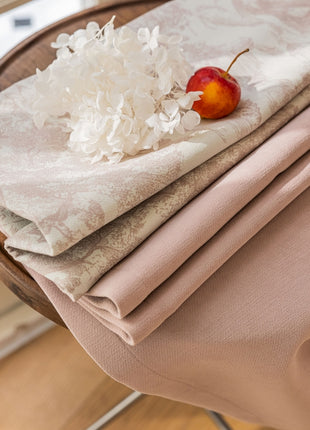 a piece of cloth with a cherry on top of it