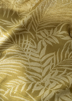 a close up of a fabric with a leaf pattern