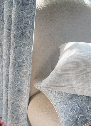 a close up of a chair with a pillow on it