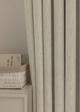 a book sitting on top of a white table next to a window