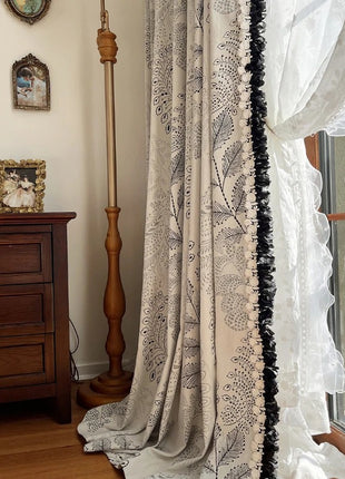 a window with a curtain and a clock on the wall