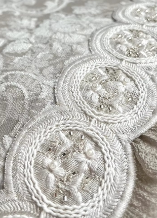 a close up view of a white lace