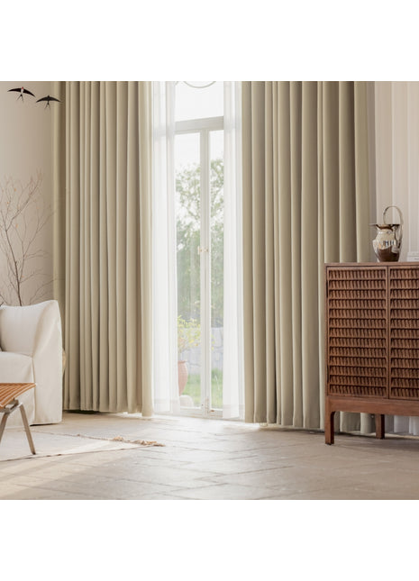 a living room with a white couch and a large window