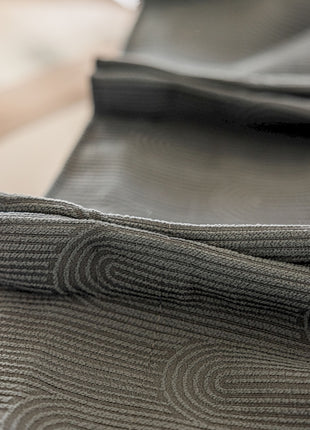 a close up of a tie on a table
